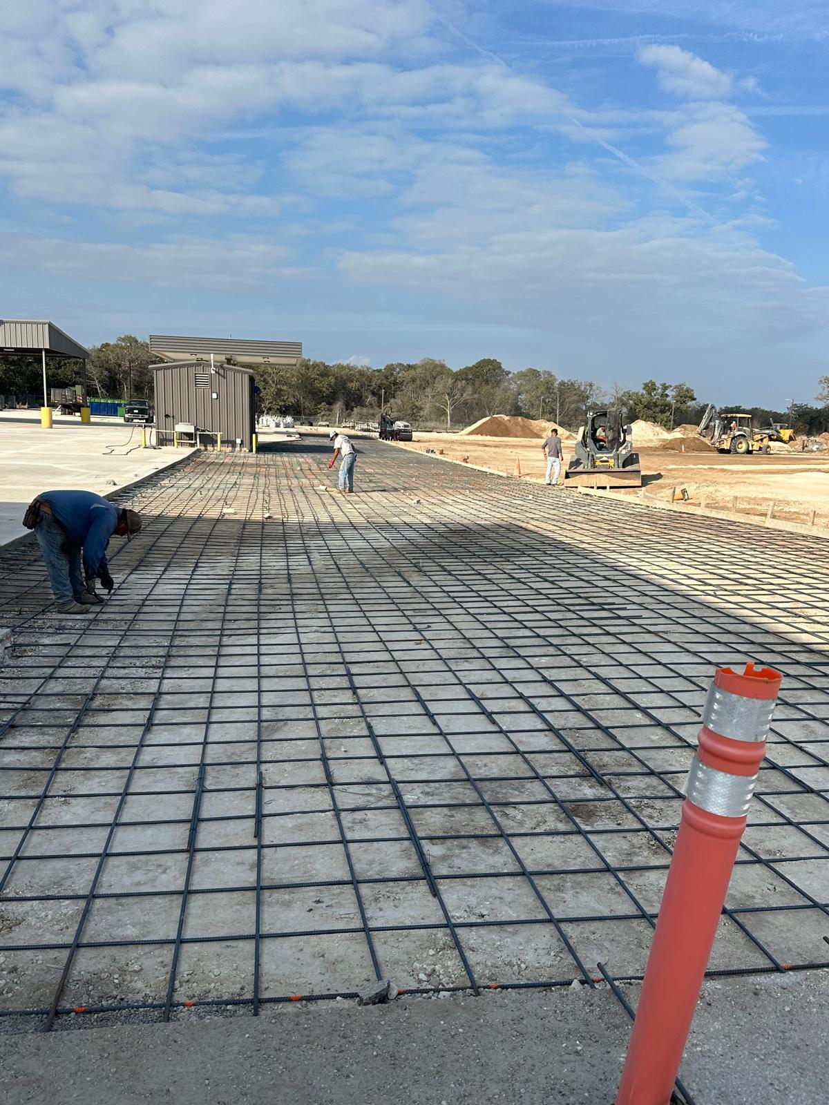 Cracking on a concrete driveway surface during peak summer heat